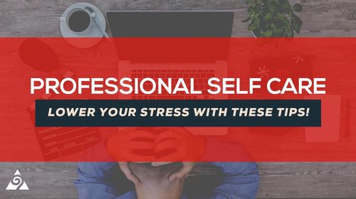 The words professional self care lower your stress with these tips are highlighted in the center of a photo with a man with his head in his hands in front of a computer