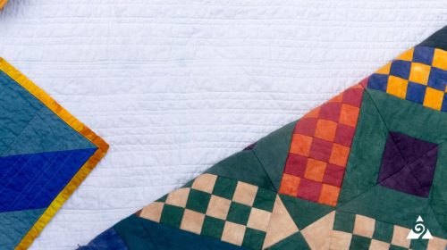 two multicolored quilts