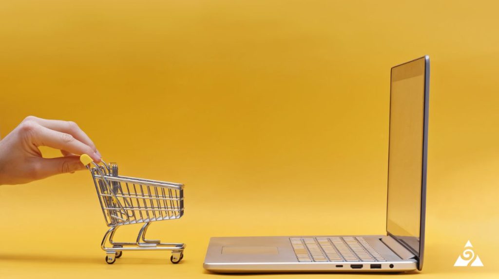 e-commerce cart and laptop